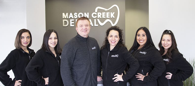 Dr. Paluk with staff of Mason Creek Dental in Katy TX