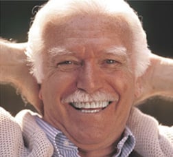 smiling older man with mustache